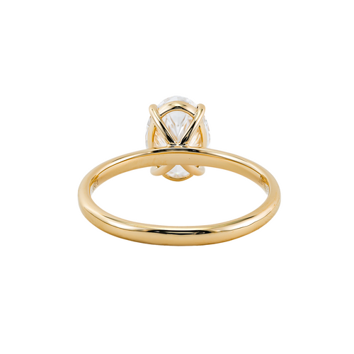A gold ring with a large diamond set in the center.