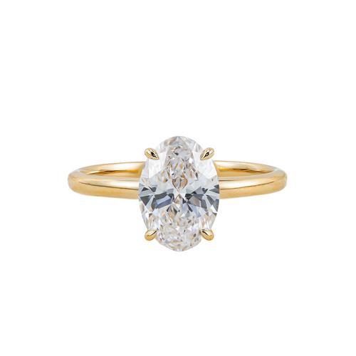 A gold ring with a large oval-shaped diamond set in the center.